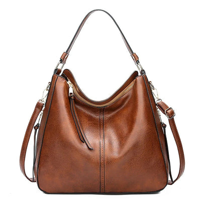 Ersilia™ - Elegant leather bag with large capacity and side pockets